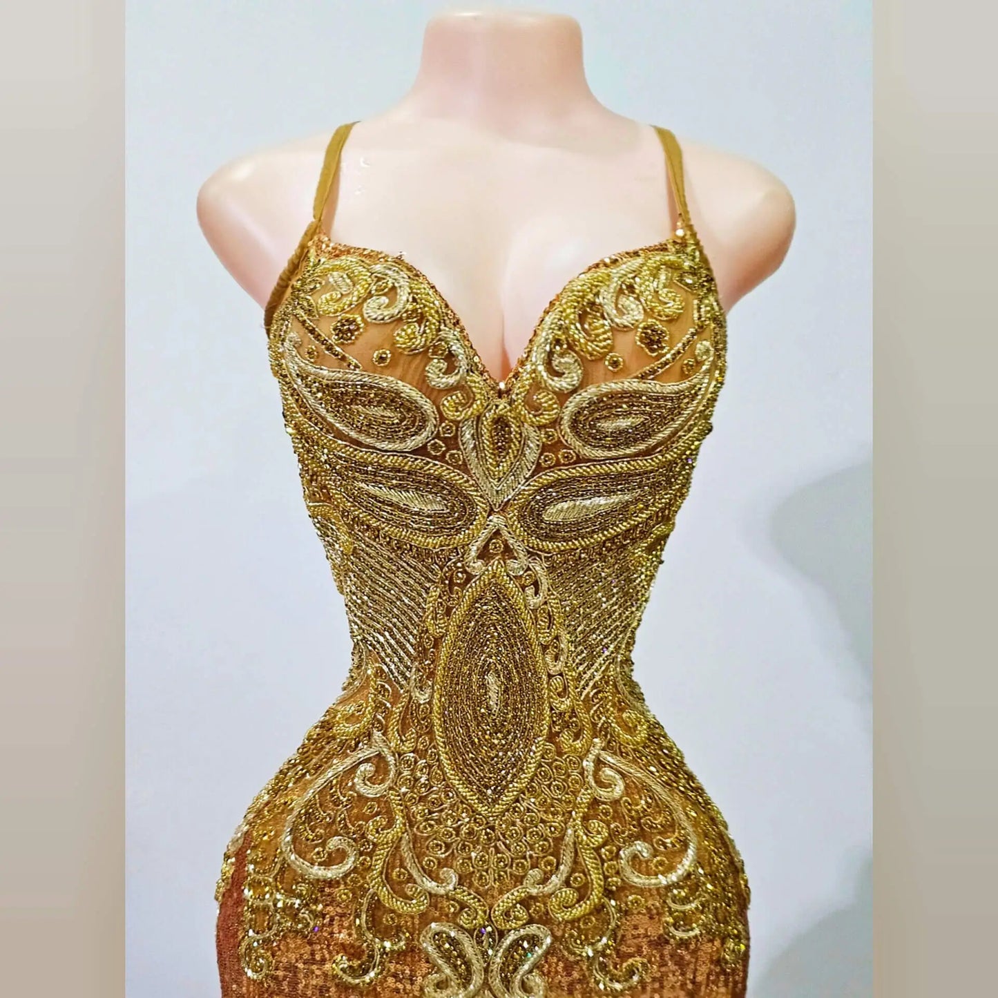 Close-up of beaded rhinestone detailing on mermaid evening gown.