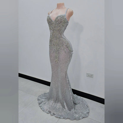 Side view of silver sequin mermaid dress with rhinestone detailing