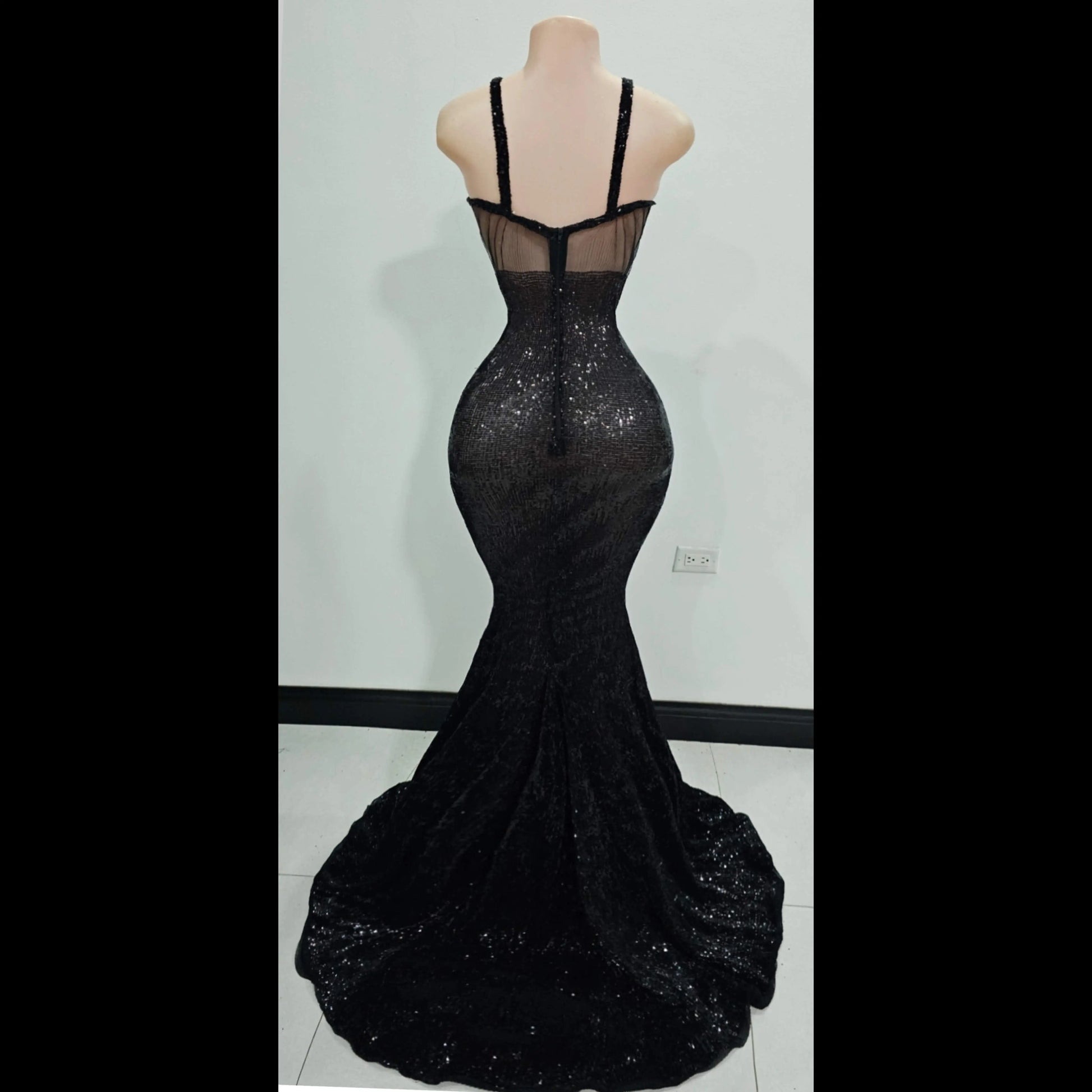 Back view of silver sequin mermaid dress with rhinestone detailing
